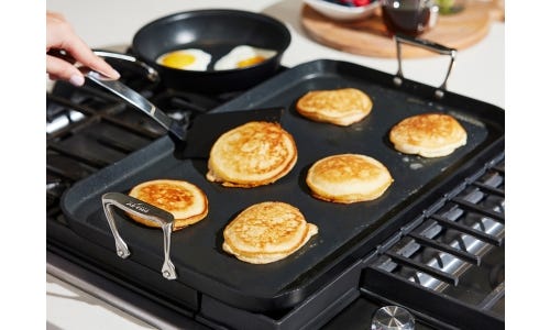 Pancakes with Banana, Walnuts, and Caramel Sauce