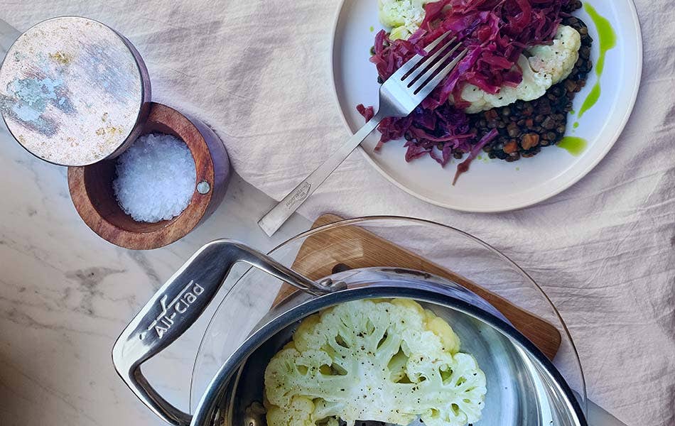 Steamed Cauliflower Steak with Cider Braised Cabbage and Lentils