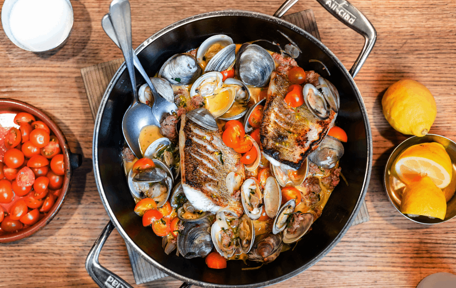 Pan Roasted Walleye with Steamed Clams, Spicy Sausage and Tomato Broth by Paul Kahan