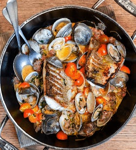 Walleye with Clams, Spicy Sausage, and Tomato Broth by Paul Kahan